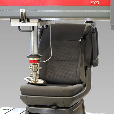 Automotive seat testing Seat testing close-up 1: Special ZwickRoell testing system for universal automotive seat testing applicable to both on the complete seat at various positions and according to common standardized foam tests